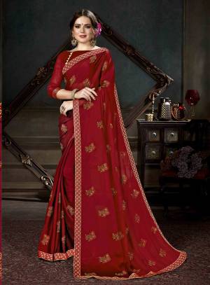 Celebrate This Festive Season With Beauty And Comfort Wearing This Designer Saree In Maroon Color Paired With Maroon Colored Blouse. This Saree Is Fabricated On Georgette Paired With Art Silk Fabricated Blouse. 