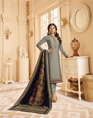 Flaunt Your Rich And Elegant Taste Wearing This Designer Straight Suit In Grey Colored Top And Bottom Paired With Navy Blue Colored Dupatta, Its Top Is Fabricated On Satin Georgette Paired With Santoon Bottom And Jacquard Silk Fabricated Dupatta. 