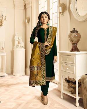 Go With The Shades Of Green With This Designer Straight Suit In Dark Green Color Paired With Pear Green Colored Dupatta. Its Top Is Fabricated On Satin Georgette Beautified With Embroidery Paired With Santoon Bottom And Jacquard Silk Dupatta. 