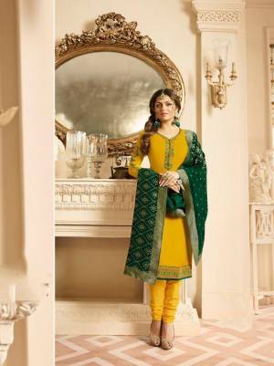 Celebrate This Festive Season With Beauty And Comfort Wearing This Designer Straight Cut Suit In Yellow Color Paired With Contrasting Green Colored Dupatta. Its Top Is Fabricated On Satin Georgette Paired With Santoon Bottom And Silk Based Dupatta. 