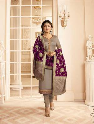 Flaunt Your Rich And Elegant Taste Wearing This Designer Straight Suit In Grey Colored Top And Bottom Paired With Wine Colored Dupatta, Its Top Is Fabricated On Satin Georgette Paired With Santoon Bottom And Jacquard Silk Fabricated Dupatta. 