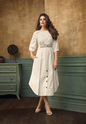 Simple And Elegant Looking Designer Readymade Kurti Is Here In White Color Fabricated On Satin Cotton. It Has Pretty Colored Thread Work Giving It An Attractive Look.  It Is Light In Weight And Easy To Carry All Day Long. 