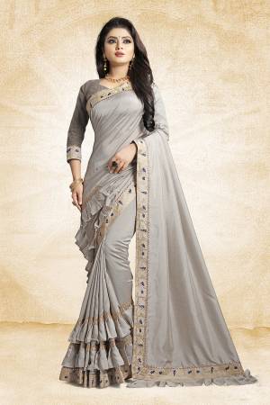 For A Pretty Designer Look, Grab This Deisgner Frill Saree In Grey Color Paired With Grey Colored Blouse. This Saree Is Fabricated On Vichitra Silk Paired With Art Silk Fabricated Blouse. It Has Very Pretty Frills And Border Giving The Saree An Attractive Look. 