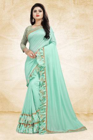 Get Ready For The Upcoming Party And Festives With This Designer Saree In Sky Blue Color Paired With Sky Blue Colored Blouse. This Saree Is Fabricated On Vichitra Silk Paired With Jacquard Silk Fabricated Blouse. It Has Very Attractive Foil Printed Frill And Lace Borders. Buy Now.