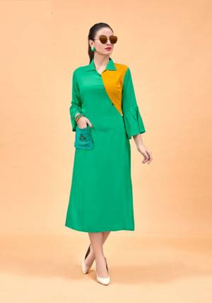 For Your Semi-Casual Wear, Grab This Designer Readymade Kurti In Green And Yellow Color Fabricated On Rayon. This Elegant Looking Plain Kurti Has Beautiful Pattern Giving It A Trendy Look. Buy This Kurti Now.