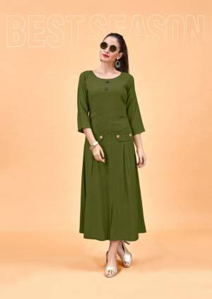 Trending And The Most Loved Color Nowdays Is Here With This Designer Readymade Kurti In Olive Green Color Fabricated On Rayon. It Is Available In All Regular Sizes, Choose As Per Your Fit And Comfort. 