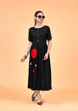 For A Bold And Beautiful Look, Grab This Designer Readymade Kurti In Black Color Fabricated On Rayon. Its Bold Black Color And Pretty Pattern Will Earn You Lots Of Compliments From Onlookers.