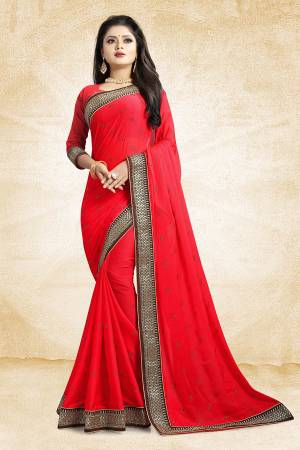 Flaunt Your Rich And Elegant Taste Wearing This Designer Saree In Red Color Paired With Red Colored Blouse. This Saree Is Fabricated On Satin Georgette Paired With Art Silk Fabricated Blouse. It Is Beautified With Heavy Embroidered Lace Border And Stone Work Butti Pattern Over The Saree. 
