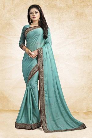 Celebrate This Festive Season With Beauty And As Well As Comfort At The Same Time With This Beautiful Designer Saree In Blue Color Paired With Blue Colored Blouse. This Saree Is Satin Georgette Based Paired With Art Silk Fabricated Blouse. It Has Heavy Embroidered Lace Border With Stone Work All Over The Saree. Buy This Designer Piece Now.