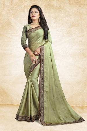 Celebrate This Festive Season With Beauty And As Well As Comfort At The Same Time With This Beautiful Designer Saree In Pastel Green Color Paired With Pastel Gren Colored Blouse. This Saree Is Satin Georgette Based Paired With Art Silk Fabricated Blouse. It Has Heavy Embroidered Lace Border With Stone Work All Over The Saree. Buy This Designer Piece Now.
