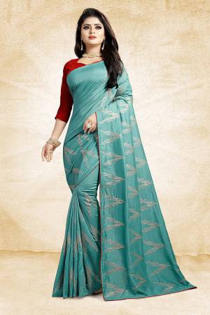 Look Pretty In This Rich And Elegant Looking Designer Saree In Turquoise Blue Color Paired With Contrasting Red Colored Blouse. This Saree And Blouse Are Silk Based Beautified With Attractive Embroidery. Also It Is Light In Weight And Easy To Carry All Day Long. 