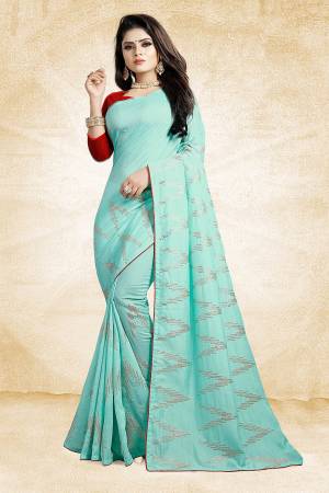 Look Pretty In This Rich And Elegant Looking Designer Saree In Sky Blue Color Paired With Contrasting Red Colored Blouse. This Saree And Blouse Are Silk Based Beautified With Attractive Embroidery. Also It Is Light In Weight And Easy To Carry All Day Long. 