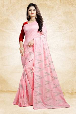 Look Pretty In This Rich And Elegant Looking Designer Saree In Pink Color Paired With Contrasting Red Colored Blouse. This Saree And Blouse Are Silk Based Beautified With Attractive Embroidery. Also It Is Light In Weight And Easy To Carry All Day Long. 