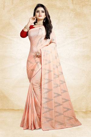 Look Pretty In This Rich And Elegant Looking Designer Saree In Peach Color Paired With Contrasting Red Colored Blouse. This Saree And Blouse Are Silk Based Beautified With Attractive Embroidery. Also It Is Light In Weight And Easy To Carry All Day Long. 
