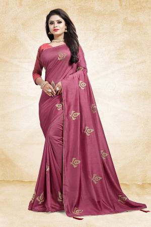 For A Bold And Beautiful Look This Festive Season, Grab This Designer Saree In Magenta Pink Color Paired With Dark Peach Colored Blouse. This Saree And Blouse Are Silk Based Beautified With Embroidered Butti All over The Saree. Buy This Saree Now.