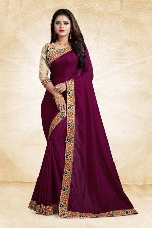 Here Is An Elegant And Royal Looking Designer Saree In Magenta Pink Color Paired With Beige Colored Blouse. This Saree And Blouse Are Silk Based Based Beautified With Contrasting Thread Work Over The Blouse And Saree Lace Border. 