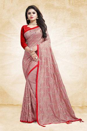 Get Ready For The Upcoming Wedding And Festive Season With This Heavy Embroidered Designer Saree In Baby Pink Color Paired With Contrasting Red Colored Blouse. This Saree And Blouse are Silk Based Beautified With Embroidery All Over The Saree.