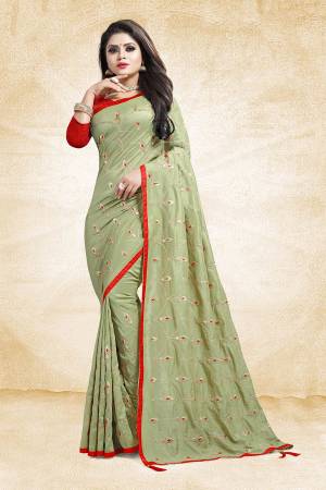 Get Ready For The Upcoming Wedding And Festive Season With This Heavy Embroidered Designer Saree In Pastel Green Color Paired With Contrasting Red Colored Blouse. This Saree And Blouse are Silk Based Beautified With Embroidery All Over The Saree.