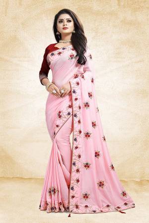 Look Beautiful And Earn Lots Of Compliments Wearing This Designer Saree In Baby Pink Color Paired With Contrasting Maroon Colored Blouse. This Saree And Blouse Are Silk Based Beautified With Attractive Embroidery Which Gives An Elegant And Trendy Look To The Saree.