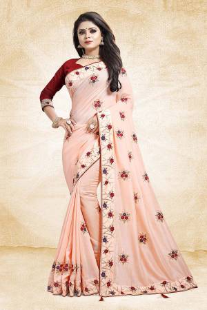 Look Beautiful And Earn Lots Of Compliments Wearing This Designer Saree In Peach Color Paired With Contrasting Maroon Colored Blouse. This Saree And Blouse Are Silk Based Beautified With Attractive Embroidery Which Gives An Elegant And Trendy Look To The Saree.