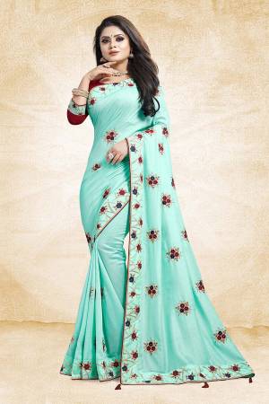 Look Beautiful And Earn Lots Of Compliments Wearing This Designer Saree In Aqua Blue Color Paired With Contrasting Maroon Colored Blouse. This Saree And Blouse Are Silk Based Beautified With Attractive Embroidery Which Gives An Elegant And Trendy Look To The Saree.