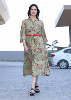 Go Floral With This Designer Reaydmade Kurti In Light Green Color Fabricated On Rayon Beautified With Floral Prints All Over. It Is Light In Weight And Easy To Carry All Day Long. 