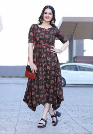 Another Pretty Floral Printed Readymade Kurti Is Here In Dark Brown Color Fabricated On Rayon. It Is Beautified With Contrasting Floral Prints All Over, Buy Now.
