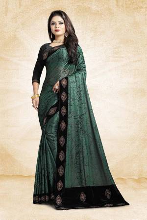Here Is A Very Pretty And elegant Looking Designer Saree In Teal Green Color Paired With Black Colored Blouse For Party Wear. This Saree And Blouse Are Based On Fancy China Fabric Beautified With Lace Borders. Also It Is Durable, Easy To Drape And Carry All Day Long. 