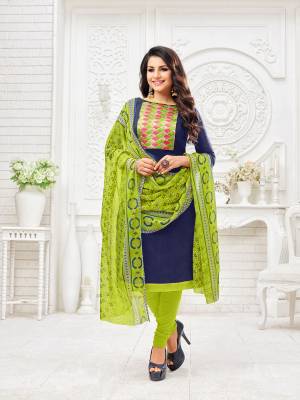 Enhance Your Personality Wearing This Dress Material In Navy Blue Colored Top Paired with Contrasting Parrot Green Colored Bottom And Dupatta, Its Top Is Fabricated On Modal Silk Paired With Cotton Bottom And Chiffon Fabricated Dupatta. 