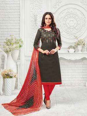 Flaunt Your Rich And Elegant Taste Wearing This Designer Suit In Dark Grey Colored Top Paired With Red Colored Bottom And Dupatta. Its Thread Embroidered Top Is Fabricated On Modal Silk Paired With Cotton Bottom And Chiffon Fabricated Dupatta. 
