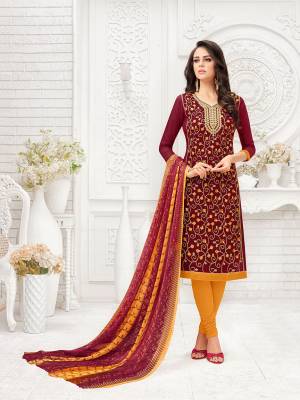 Here Is A Proper Traditional Color Pallete With This Designer Dress Material In Maroon Colored Top Paired With Contrasting Musturd Yellow Colored Bottom And Maroon & Yellow Colored  Dupatta. Its Top Is Fabricated On Modal Silk Paired With Cotton Bottom And Chiffon Printed Dupatta. 
