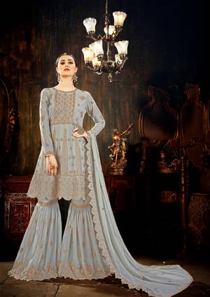 Flaunt Your Rich And Elegant Taste Wearing This Designer Sharara Suit In Grey Color. Its Top, Bottom And Dupatta are Fabricated On Georgette Beautified With Heavy Embroidery Work. Buy This Designer Semi-Stitched Suit Now.