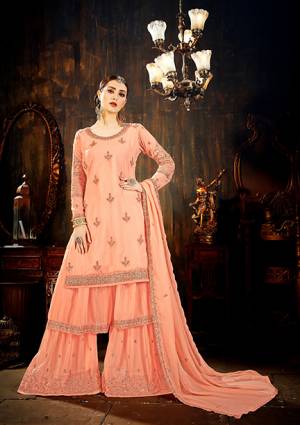 Look Pretty This Heavy Designer Sharara Suit In Dark Peach Color Paired With Dark Peach Colored Bottom are Dupatta, This All Over Suit Is Fabricated On Georgette Beautified With Heavy Attractive Embroidery. Buy This Now.