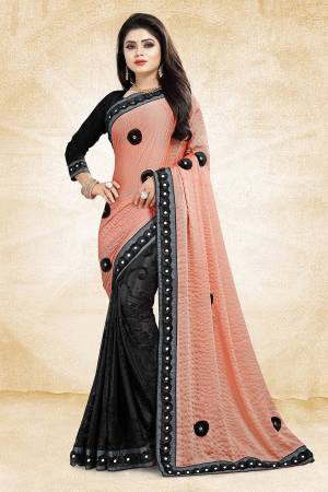 Bold And Elegant Looking Designer Saree Is Here In Peach And Black Color Paired With Black Colored Blouse. This Saree Is Fancy Fabric Based Paired With Art Silk Fabricated Blouse. It Is Beautified With 3D Work And Lace Border. Buy Now.
