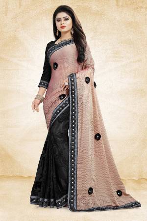 Bold And Elegant Looking Designer Saree Is Here In Beige And Black Color Paired With Black Colored Blouse. This Saree Is Fancy Fabric Based Paired With Art Silk Fabricated Blouse. It Is Beautified With 3D Work And Lace Border. Buy Now.