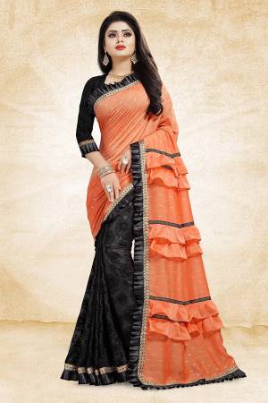 Get Ready With The Running Frill Pattern Trend With This Designer Saree In Orange And Black Color Paired With Black Colored Blouse. This Saree Is Fabricated On Fancy Fabrics Paired With Art Silk Fabricated Blouse. It Is Beautified With Frill And Lace Border. Buy Now.
