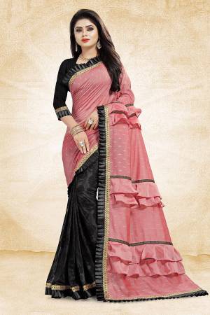 Get Ready With The Running Frill Pattern Trend With This Designer Saree In Pink And Black Color Paired With Black Colored Blouse. This Saree Is Fabricated On Fancy Fabrics Paired With Art Silk Fabricated Blouse. It Is Beautified With Frill And Lace Border. Buy Now.
