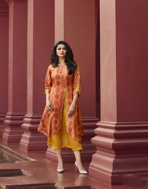 Beat The Heat With Bright Shades Wearing This Designer Readymade Kurti In Orange And Yellow Color Fabricated On Art Silk And Satin. This Kurti Is Beautified With Prints And Stone Work. Buy Now.