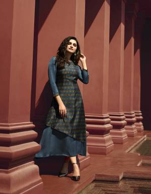 Enhance Your Personality Wearing This Designer Readymade Double Layered Kurti In Dark Blue Color. This Kurti Is Fabricated On Art Silk And Satin Beautified With Prints And Stone Work. 