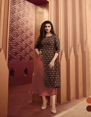 Rich Color Pallete Is Here With This Designer Readymade Kurti In Brown And Rust Color Fabricated On Art Silk And Satin .This Kurti Is Beautified With Prints And Stone Work. This Double Layered Kurti Has Pretty Asymetric Pattern. Buy Now.