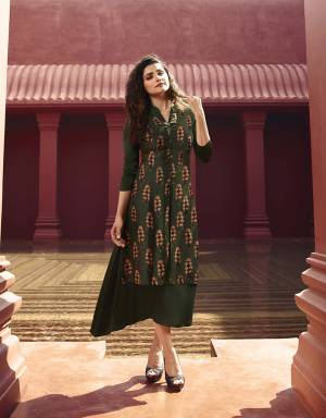 Look Attractive In This Designer Readymade Kurti In Dark Green Color Fabricated On Art Silk And Satin Beautified With Prints And Stone Work. Buy Now.