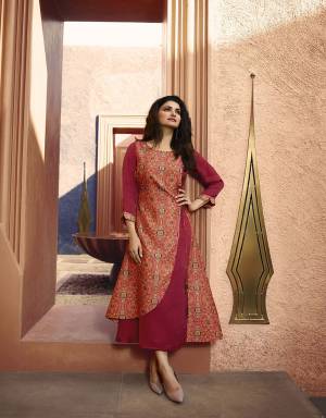 Bright And Visually Appealing Color Is Here With This Designer Readymade Kurti In Dark Pink Color Fabricated On Art Silk And Satin. It Is Beautified With Prints And Stone Work Which Gives An Attractive Look To Your Personality. 
