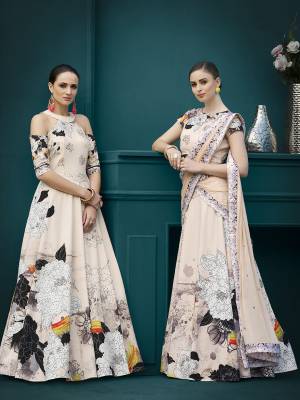 Get Ready For The Upcoming Festive And Wedding Season With This Designer Two One Lehenga Choli Cum Gown. This Designer Lehenga Choli Is Fabricated On Spandex Silk Beautified With Bold Floral Prints And Stone Work Paired With Chiffon Fabricated Dupatta. 