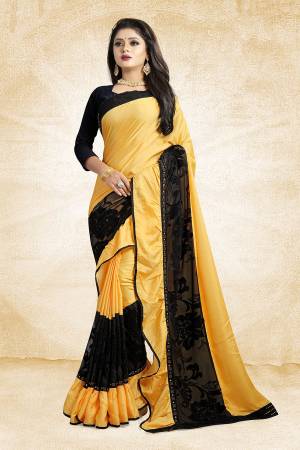 Adopt The Fashion Trend In Your Style With This Designer Frill Saree In Yellow And Black Color Paired With Black Colored Blouse, This Saree Is Fabricated On Soft Silk Paired With Art Silk Fabricated Blouse. It Is Beautified with Fancy Lace Border And Frill. Buy This Saree Now.