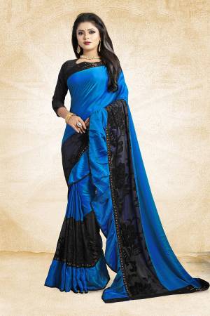 Adopt The Fashion Trend In Your Style With This Designer Frill Saree In Royal Blue And Black Color Paired With Black Colored Blouse, This Saree Is Fabricated On Soft Silk Paired With Art Silk Fabricated Blouse. It Is Beautified with Fancy Lace Border And Frill. Buy This Saree Now.