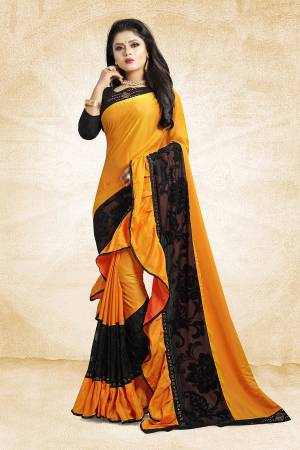 Adopt The Fashion Trend In Your Style With This Designer Frill Saree In Musturd Yellow And Black Color Paired With Black Colored Blouse, This Saree Is Fabricated On Soft Silk Paired With Art Silk Fabricated Blouse. It Is Beautified with Fancy Lace Border And Frill. Buy This Saree Now.