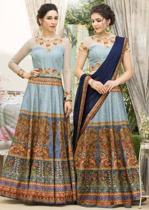 Grab This Beautiful Designer Two In One Lehenga Choli Cum Gown In Sky Blue Color. You Can Get This Stitched As A Lehenga Or Floor Length Gown As Per Your Occasion And Convenience. Its Blouse Are Lehenga Are Fabricated On Banarasi Art Silk Beautified With Digital Prints And Embroidery Paired With Chiffon Fabricated Dupatta. Buy This Heavy Designer Piece Now. 