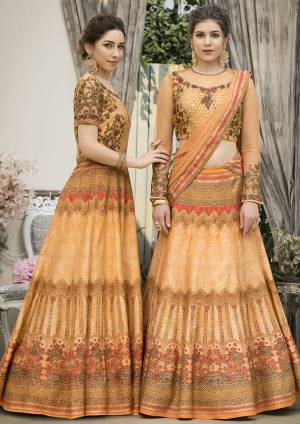 Grab This Beautiful Designer Two In One Lehenga Choli Cum Gown In Musturd Yellow Color. You Can Get This Stitched As A Lehenga Or Floor Length Gown As Per Your Occasion And Convenience. Its Blouse Are Lehenga Are Fabricated On Banarasi Art Silk Beautified With Digital Prints And Embroidery Paired With Chiffon Fabricated Dupatta. Buy This Heavy Designer Piece Now. 
