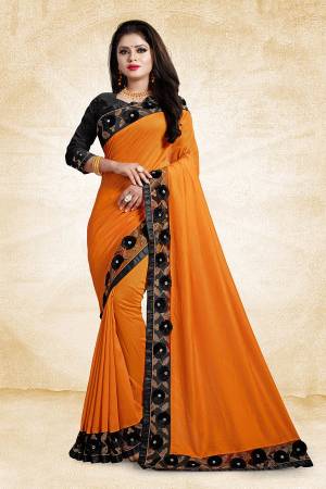 Look Pretty In This Designer Silk Based Saree In Saffron4 Color Paired With Black Colored Blouse. This Saree And Blouse Are Silk Based Beautified With Embroidered Lace Border With 3D Work. 