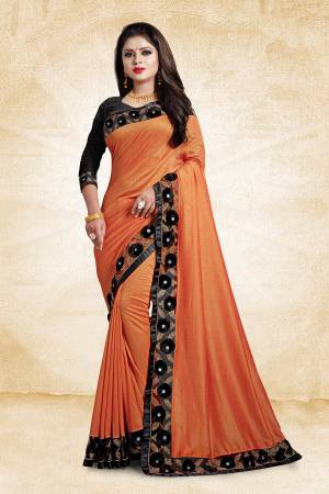 Look Pretty In This Designer Silk Based Saree In Orange Color Paired With Black Colored Blouse. This Saree And Blouse Are Silk Based Beautified With Embroidered Lace Border With 3D Work. 